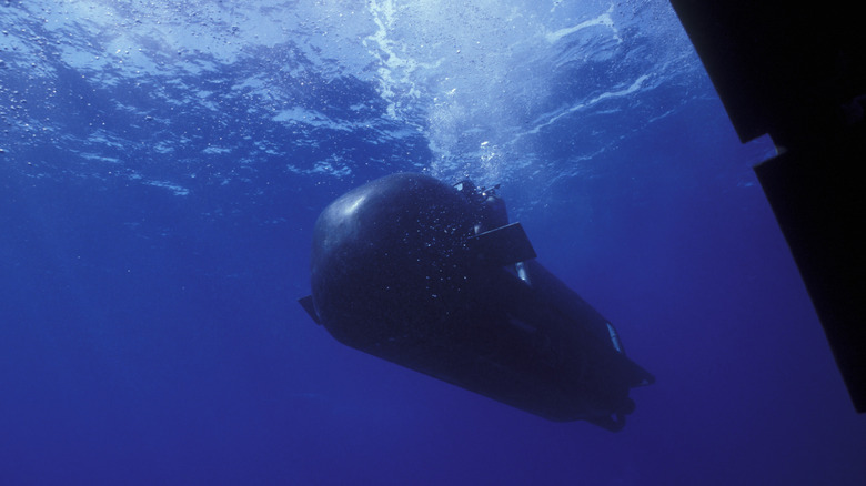 SEAL delivery vehicle (SDV) underwater and rising toward the surface