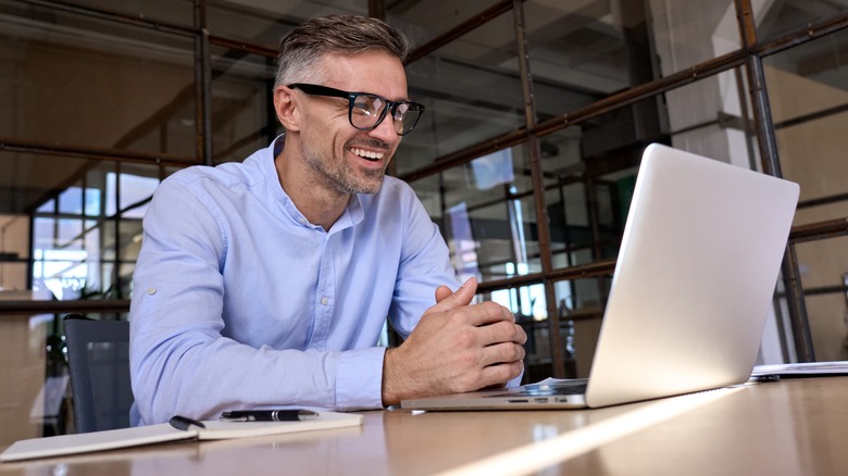 Person with laptop at desk