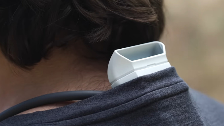 Reon Pocket Pro Plus poking through back of shirt