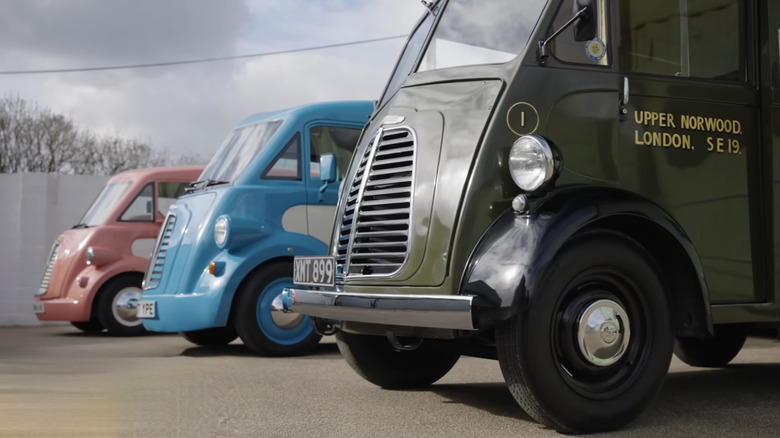 Picture showing old and new Morris Commercial vans parked next to each other
