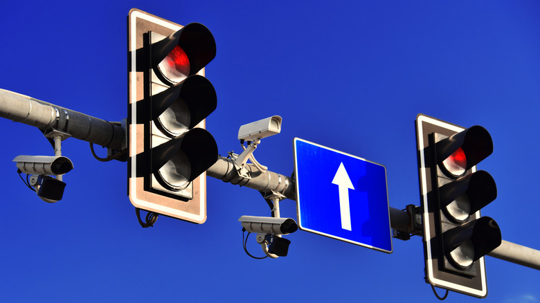 Two red lights with several cameras installed