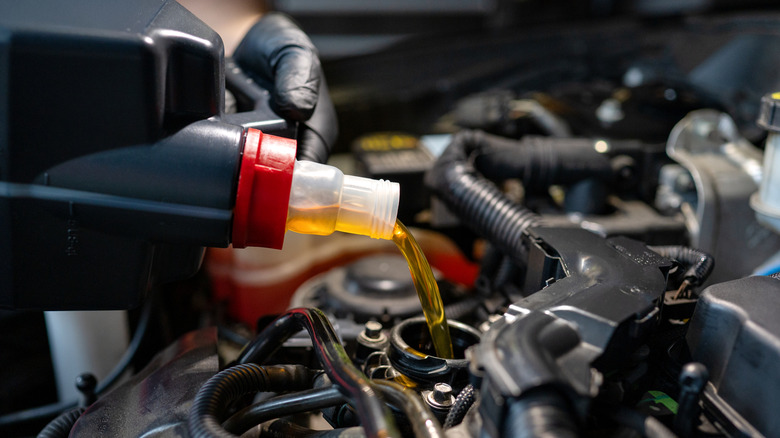 Engine oil poured into a car's engine