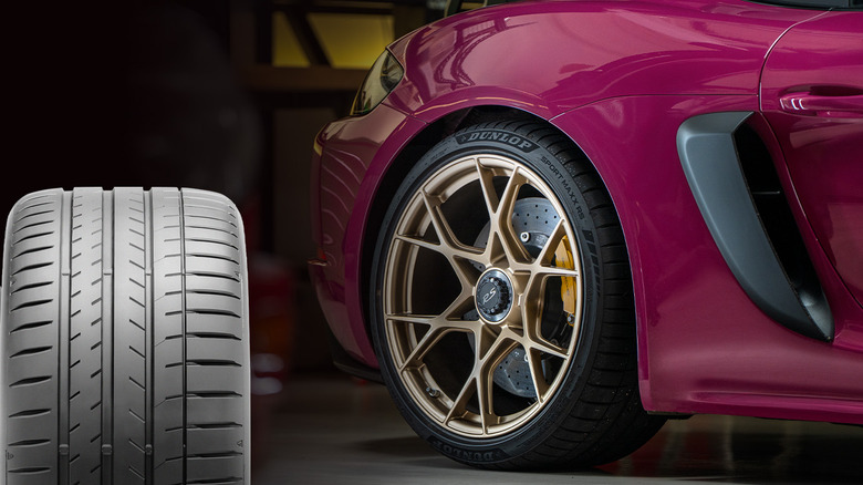 Dunlop Sport Maxx RS tire tread next to Porsche Cayman RS with Dunlop tire mounted on it