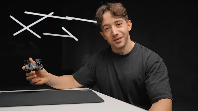 Ali from Optimum Tech holding a Zeromouse