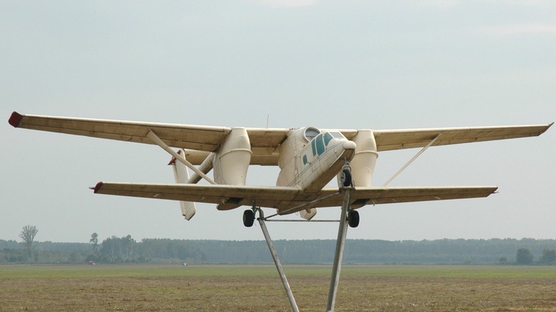 PZL M-15 Belphegor on display in a field, set to look like its in flight
