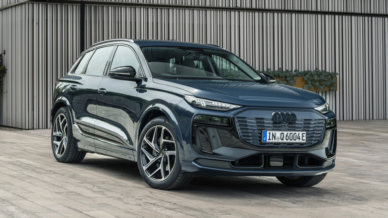 Blue Audi Q6 e-tron parked in front of a building