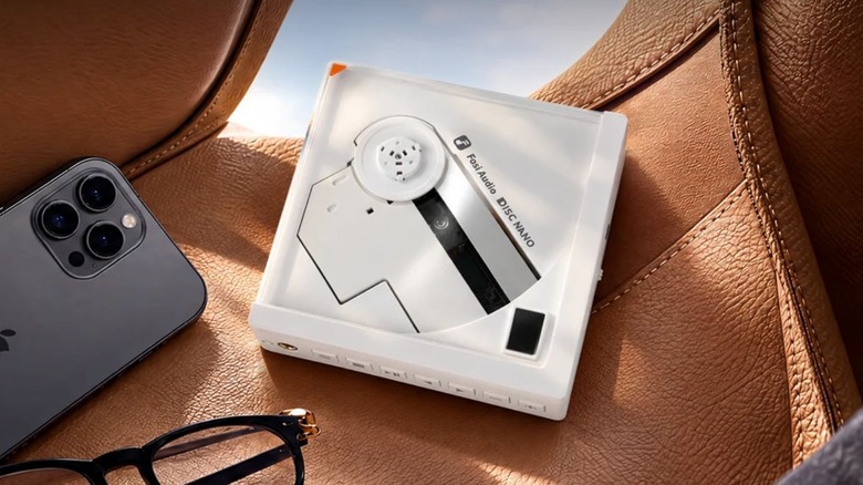 A white Disc Nano against a handbag.