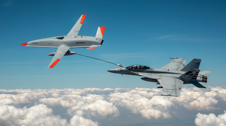 The Boeing MQ-25 Stingray refueling a fighter jet