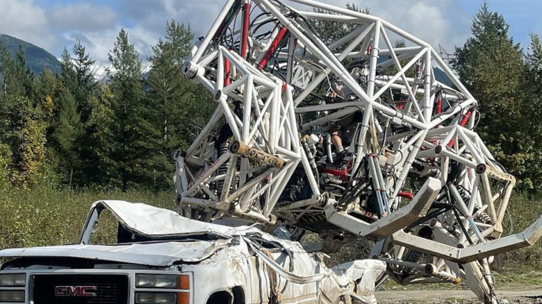 mech suit smashing a truck