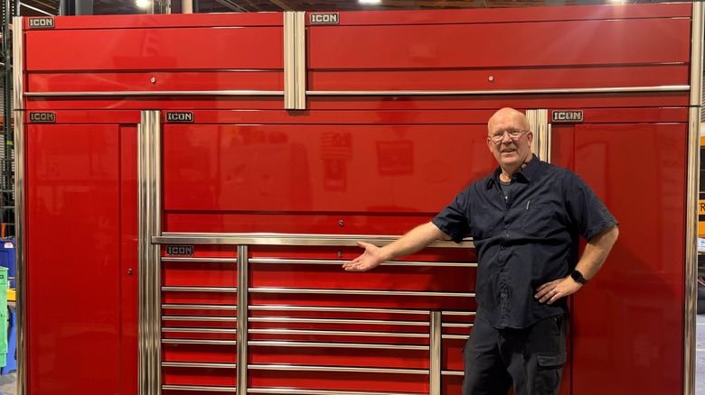 A man presenting a large array of Icon tool cases from Harbor Freight.