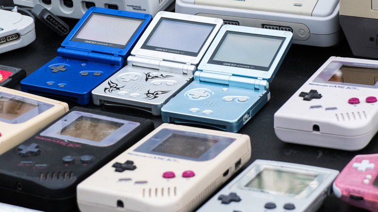 A row of three rare Game Boy Advance SPs alongside several Game Boys.