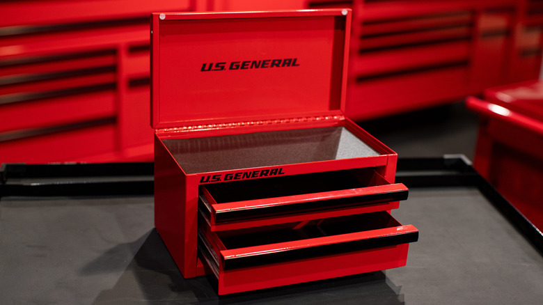 An open Mini U.S. General Harbor Freight storage toolbox in red.