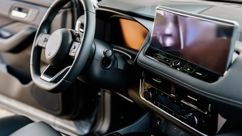 Close up of the interior of a vehicle from the driver's seat.