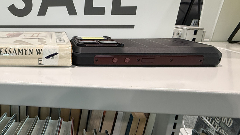 Oukitel WP300 next to a book
