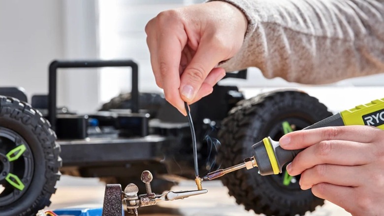 Person using Ryobi USB Soldering Pen