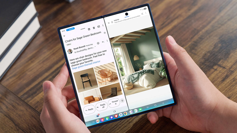 A person holding a Samsung Galaxy Z Fold 7 and reading an email on it