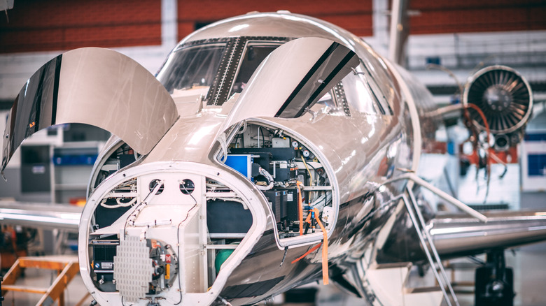 A small jet aircraft disassembled for maintenance