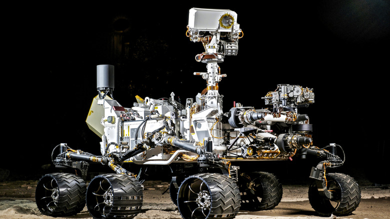 Space exploration rover against a black background