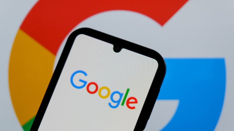 Google app on phone with Google logo in back