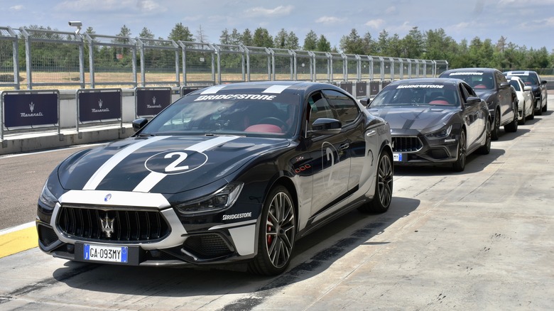 Maseratis lined up in the pit lane at Autodromo di Modena.