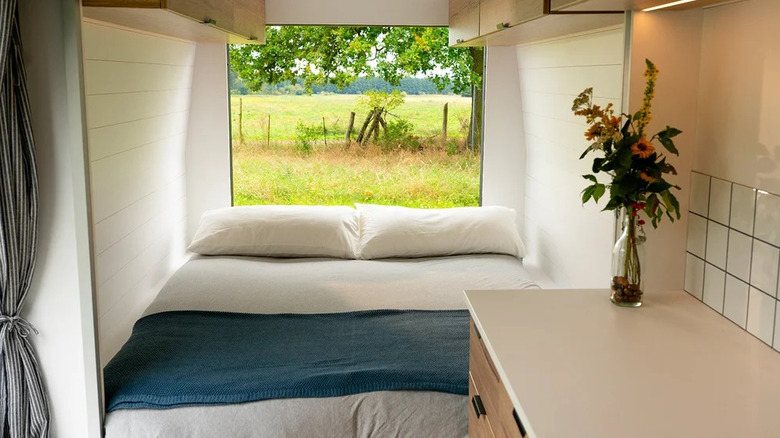 Queen bed in a Hunker Pod campervan