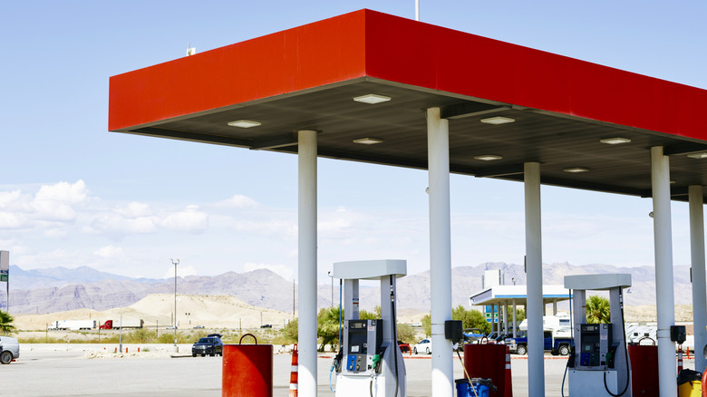 Unlabeled red gas station, viewed from parking lot