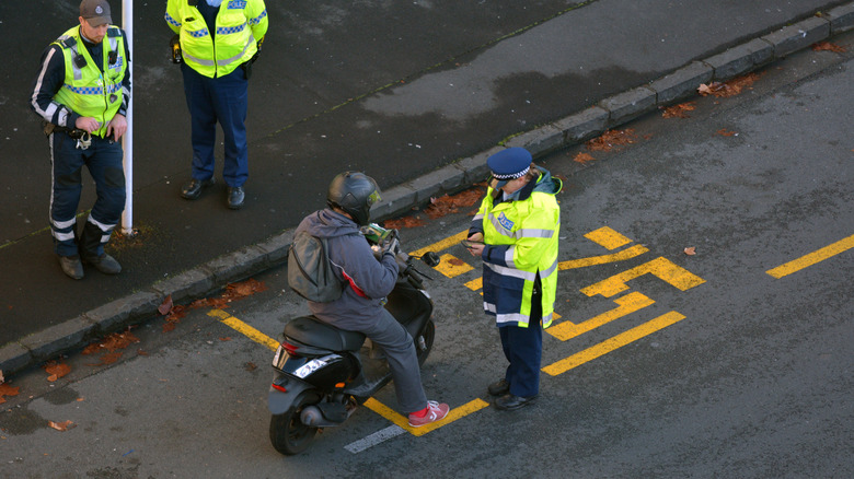 UK police write ticket for helmeted man on moped