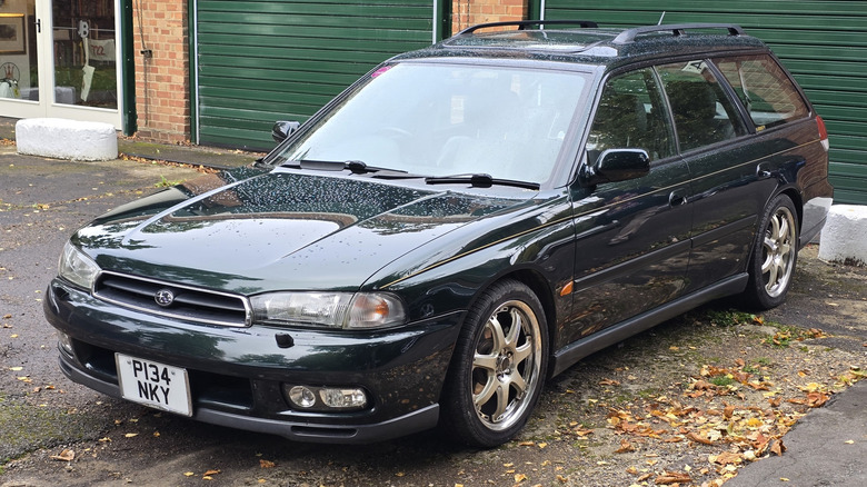 Dark green right-hand drive 1997 Subaru Legacy parked