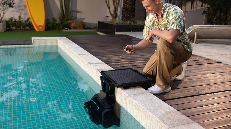 Man using a WYBOT S2Solar