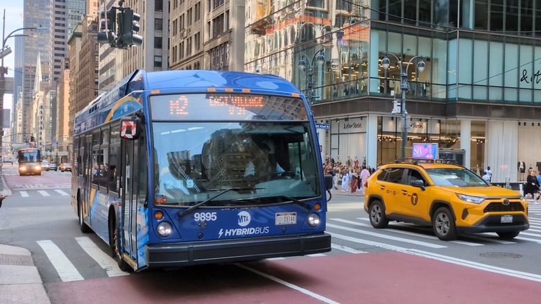 Hybrid bus in New York City with a camera mounted on the side