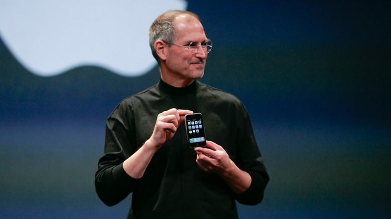 Steve Jobs holding the original iPhone in 2007.