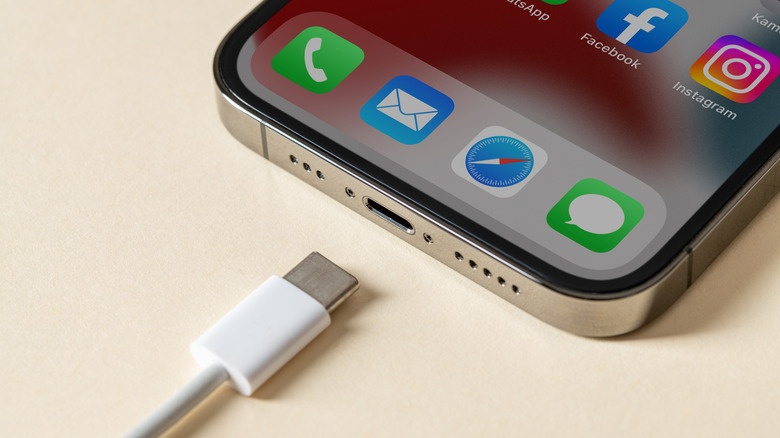 A USB-C cable going into an iPhone.