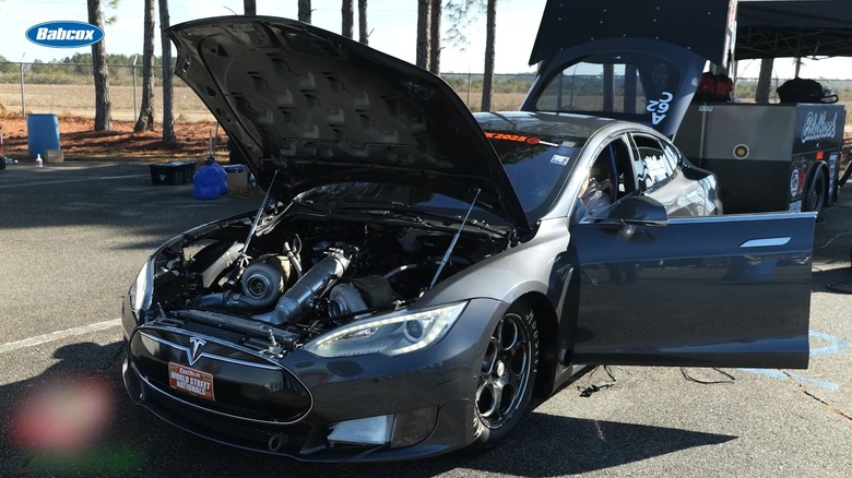 Tesla Model S with 565 big block Chevrolet engine swap with hood, truck, and doors open, front-left view