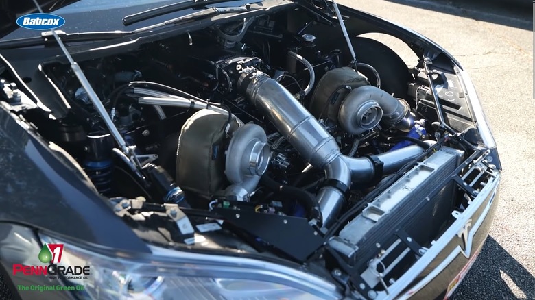 Tesla Model S with 565 big block swap engine bay showing turbos and fabricated parts