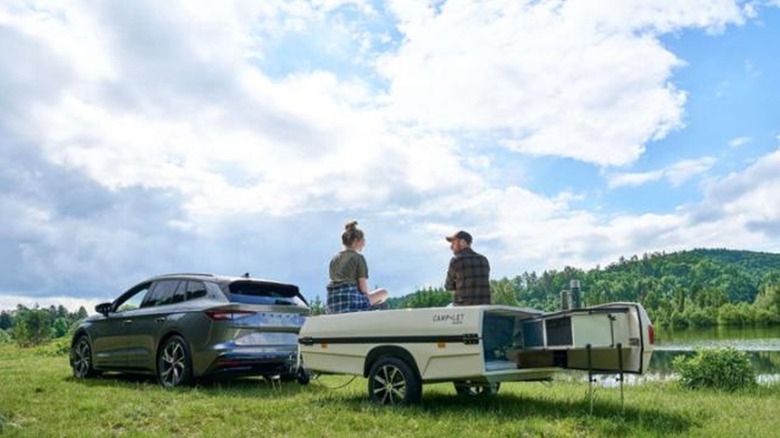 Camp-let Earth being towed behind a vehicle outside