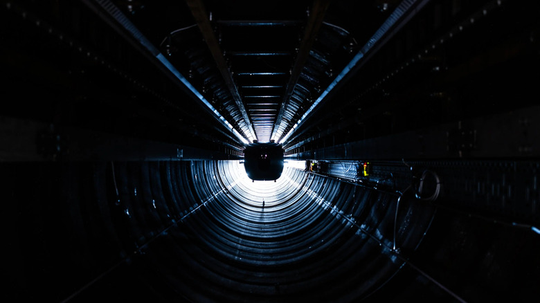A Hardt Hyperloop capsule in a dark tunnel.