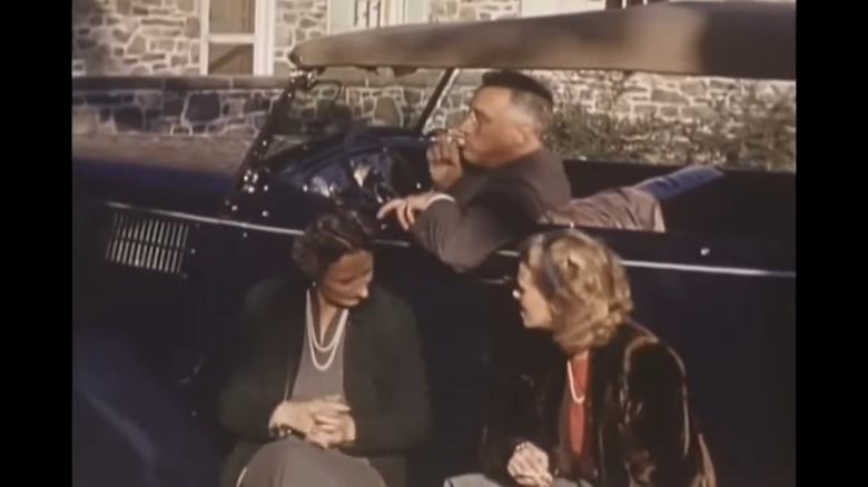 Franklin Delano Roosevelt (aka FDR) smoking a cigarette in his 1936 Ford phaeton