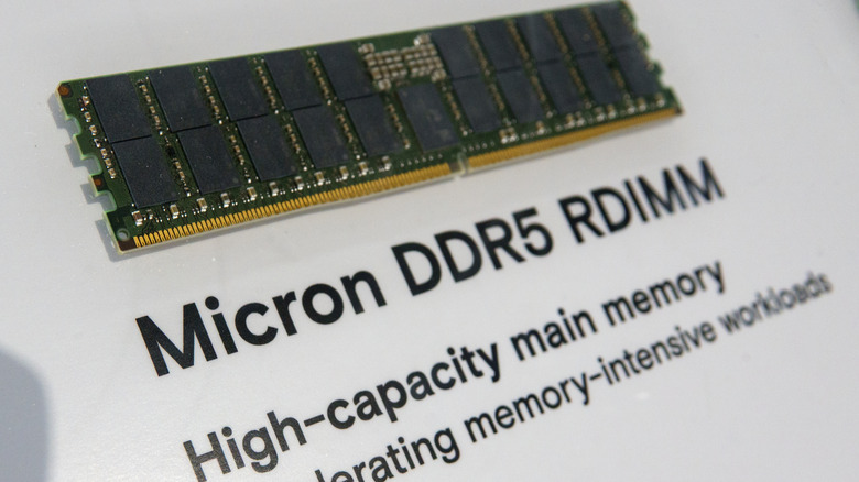 A picture of a Micron DDR5 RDIMM module at a display