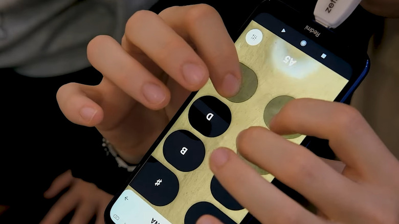 A close up of an ocarina setting on the Zefiro app, which is plugged into and playing on a Redmi smartphone.