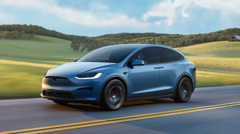 Rendering of a Tesla Model X driving down the road