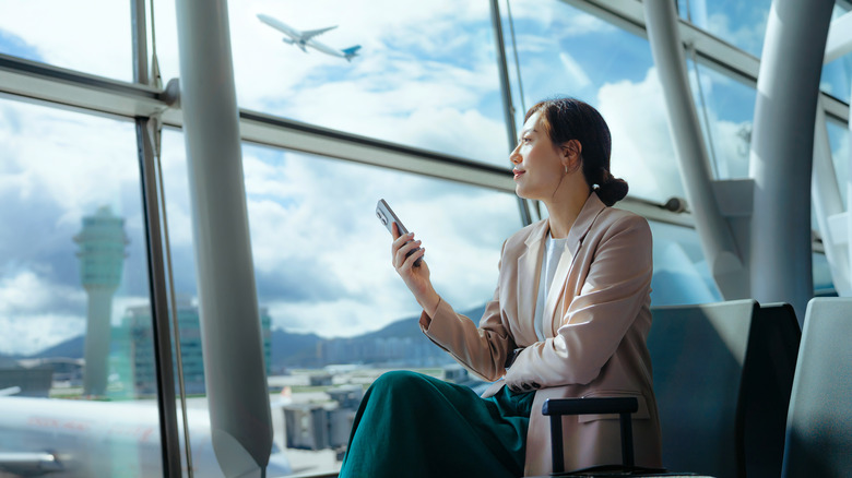 A woman sits at the airport