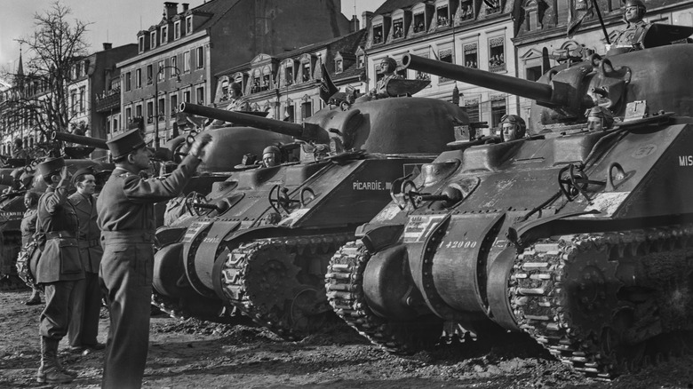 Allied M4A4 Sherman/Sherman Vs aligned in recently liberated Colmar