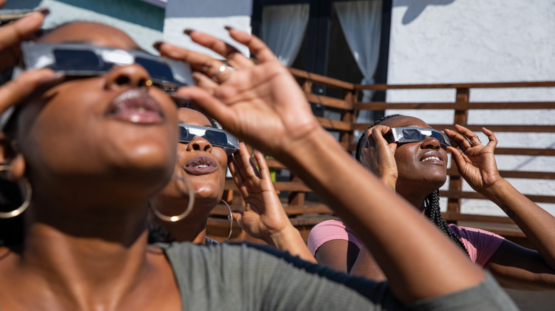 people watching a solar eclipse