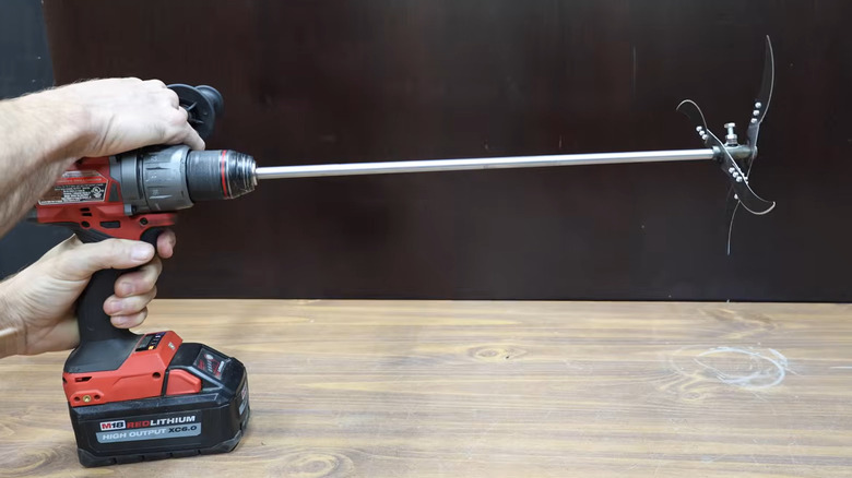 Project Farm's cheap vegetation cutter attachment with a Milwaukee drill