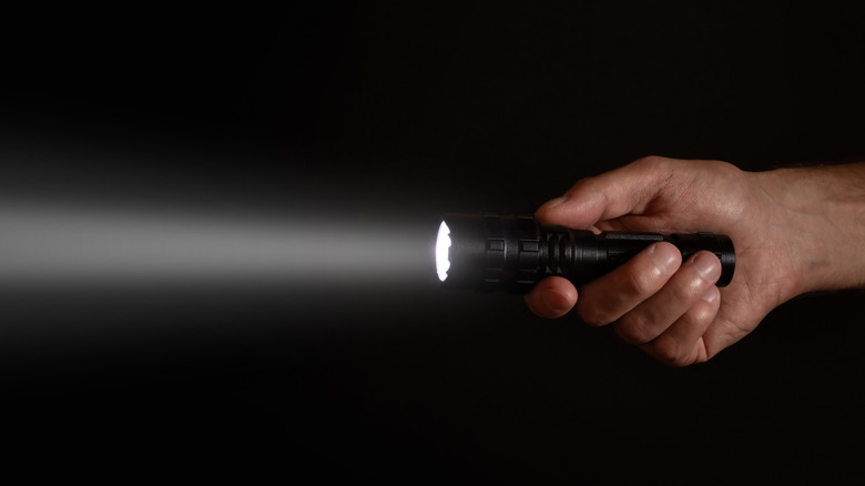 Bright beam of light emitted from a flashlight