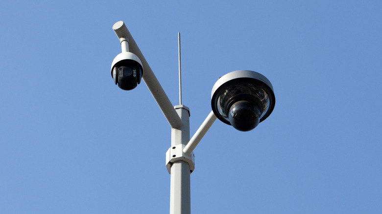 Two 360-degree cameras attached to a post.