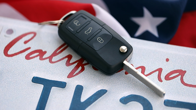 Car key on California plate above American flag