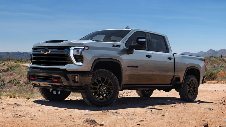 A heavy-duty Chevrolet Silverado truck parked in a desert setting.