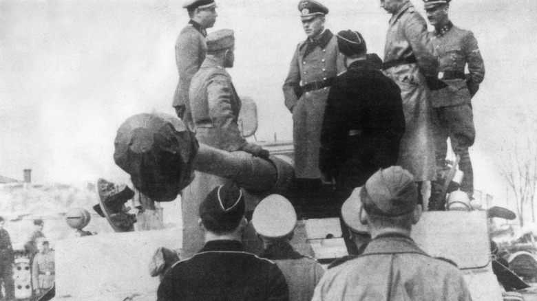 men on tiger tank