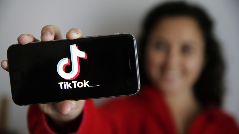 TikTok splash screen on a smartphone